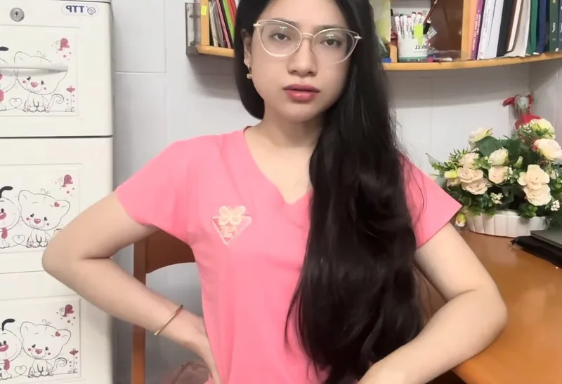 A woman with a hand on her lower back